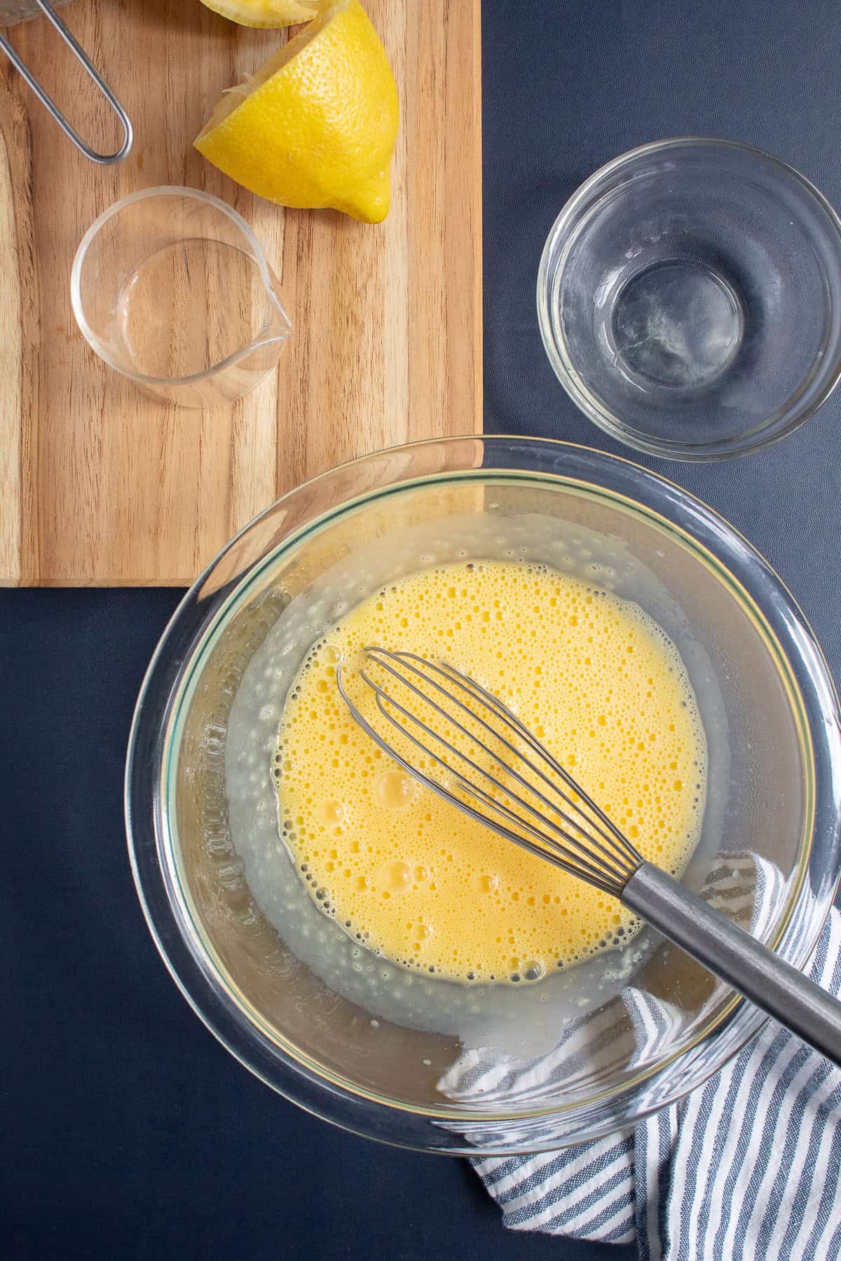 All egg yolks have been whisked into the melted butter.