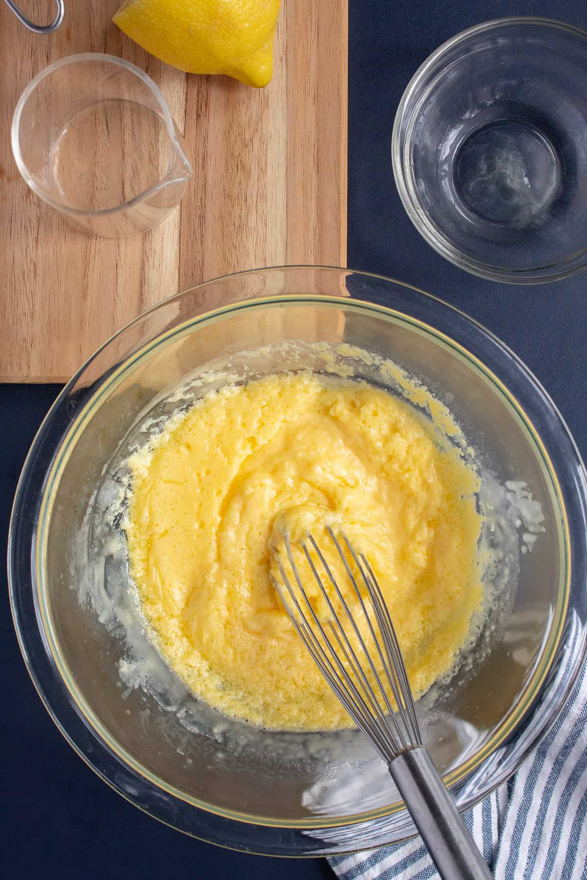 Microwaved hollandaise is whisked until smooth.