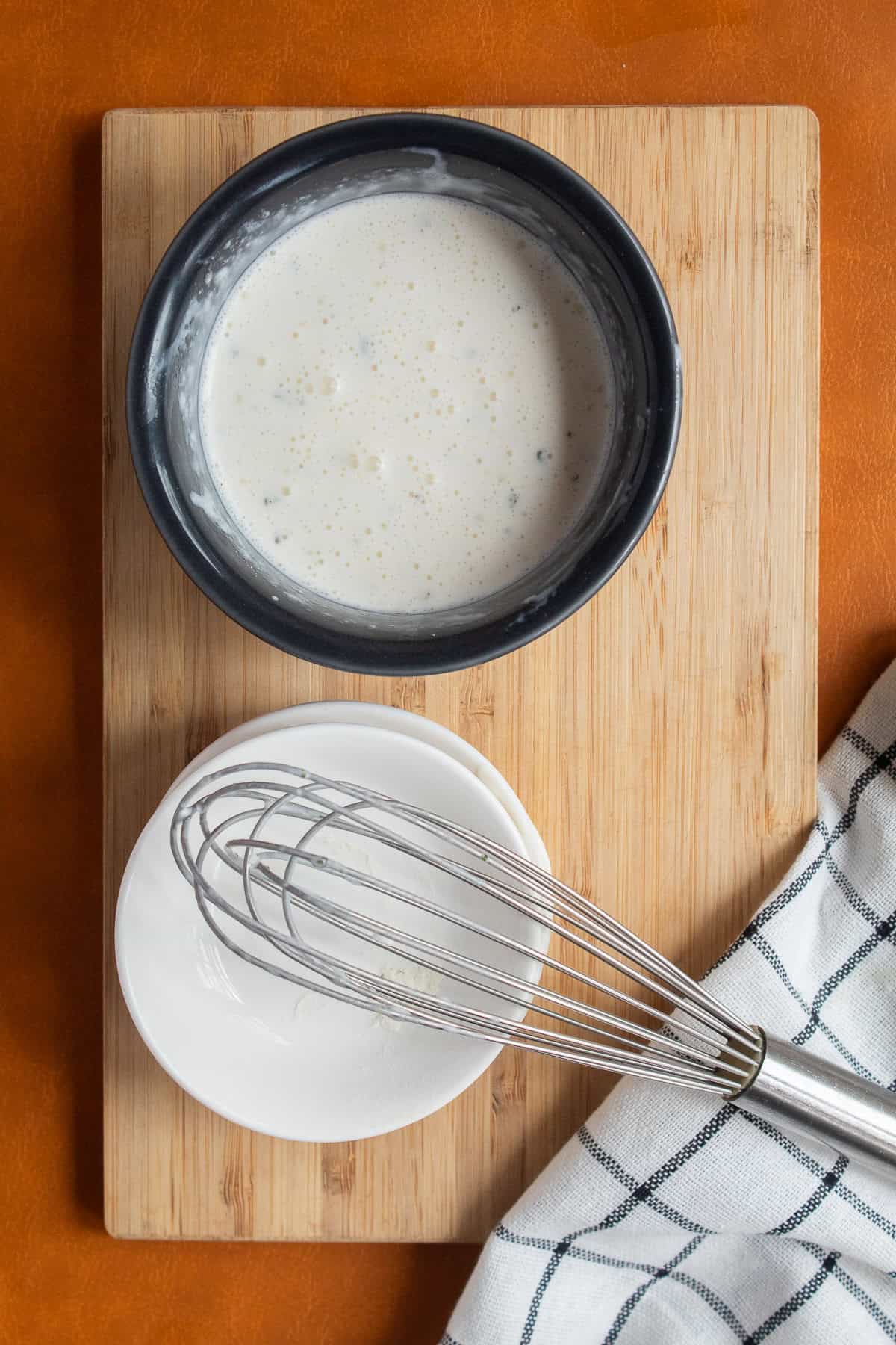 The ranch sauce is whisked until smooth.