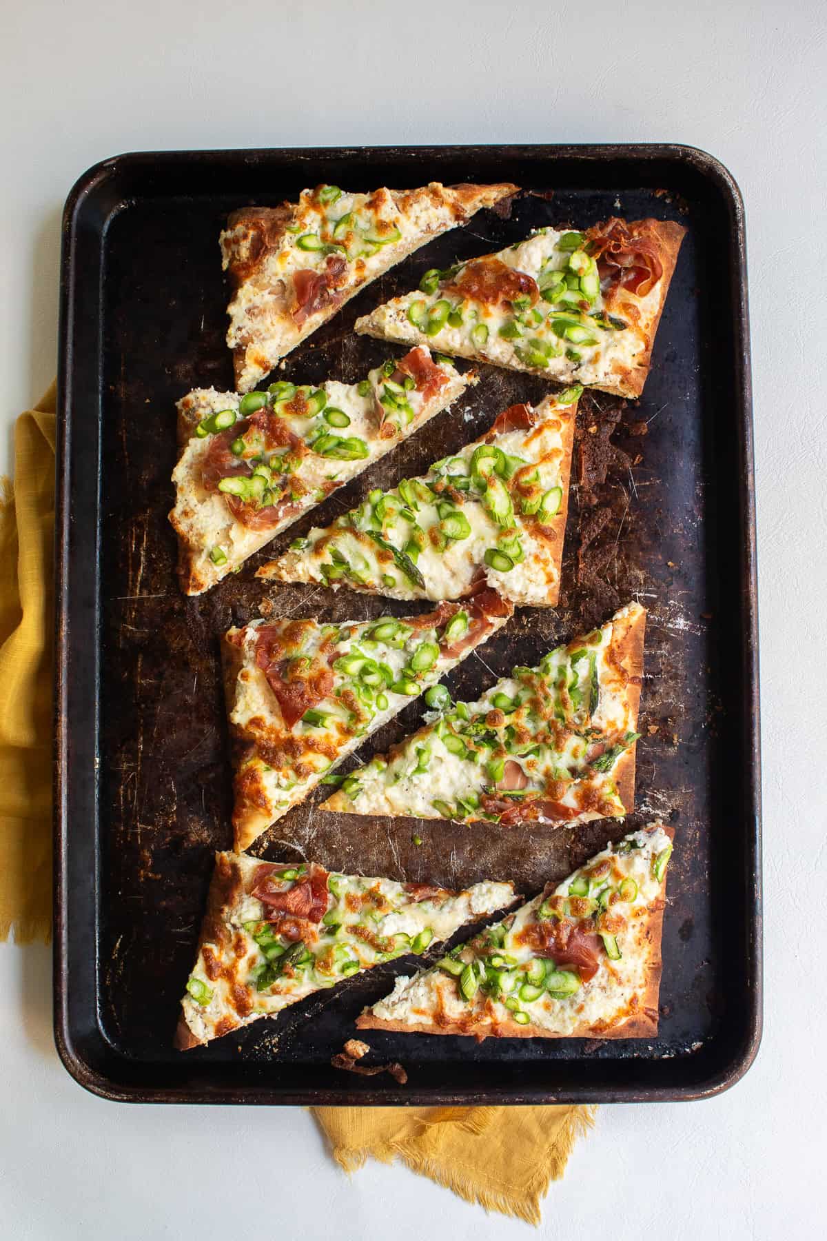 The sliced pizza can be served directly from the sheet pan.