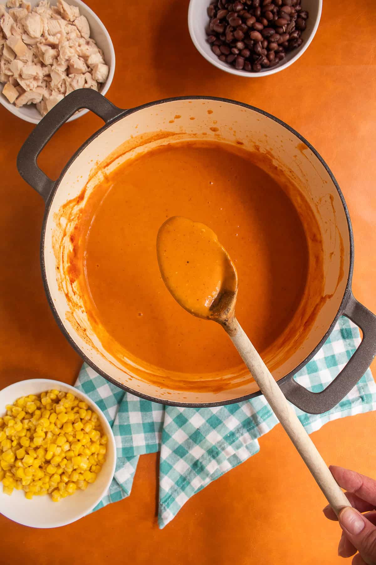 The blended soup is thick and creamy and a deep orange color.