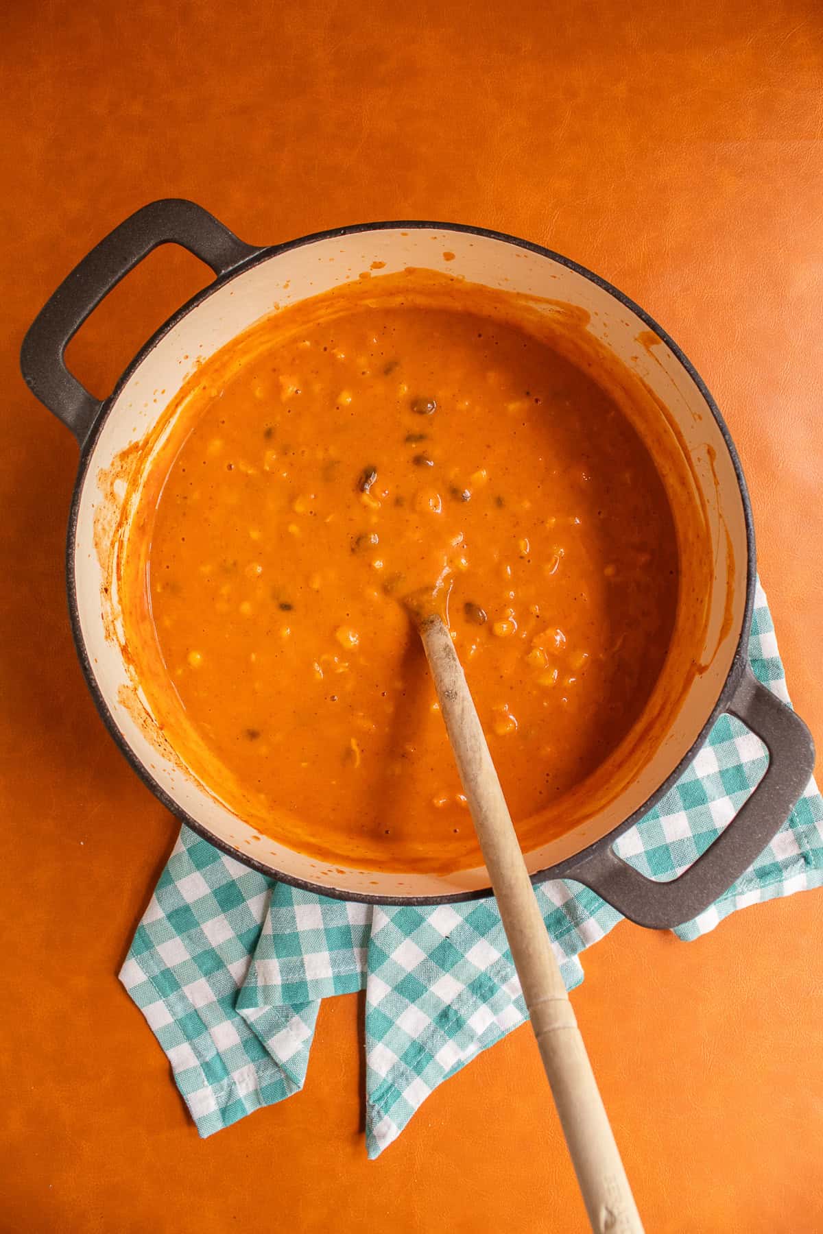 The finished soup is thick and studded with chicken, beans, and corn.