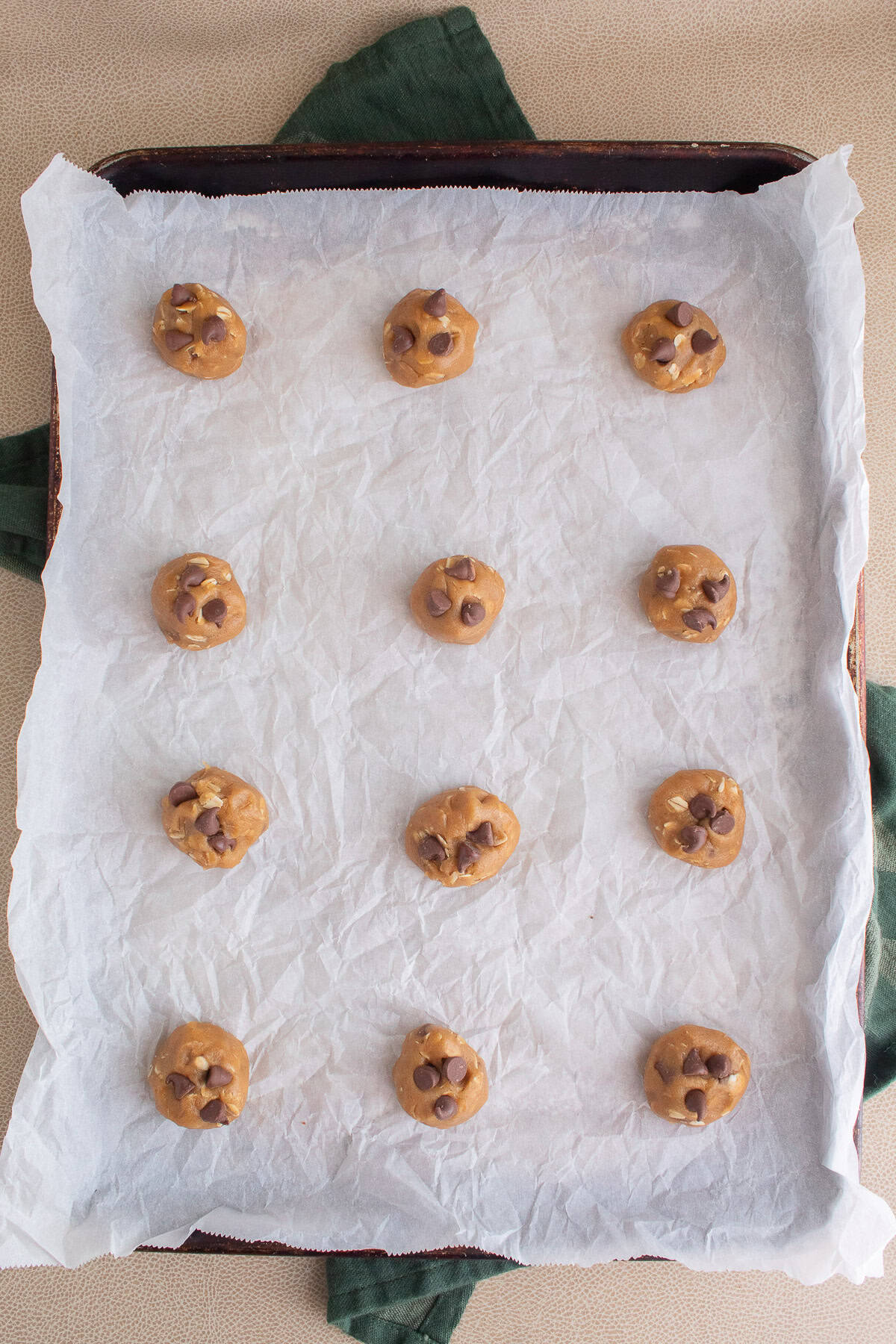 Extra chocolate chips are added to each ball of dough before baking.