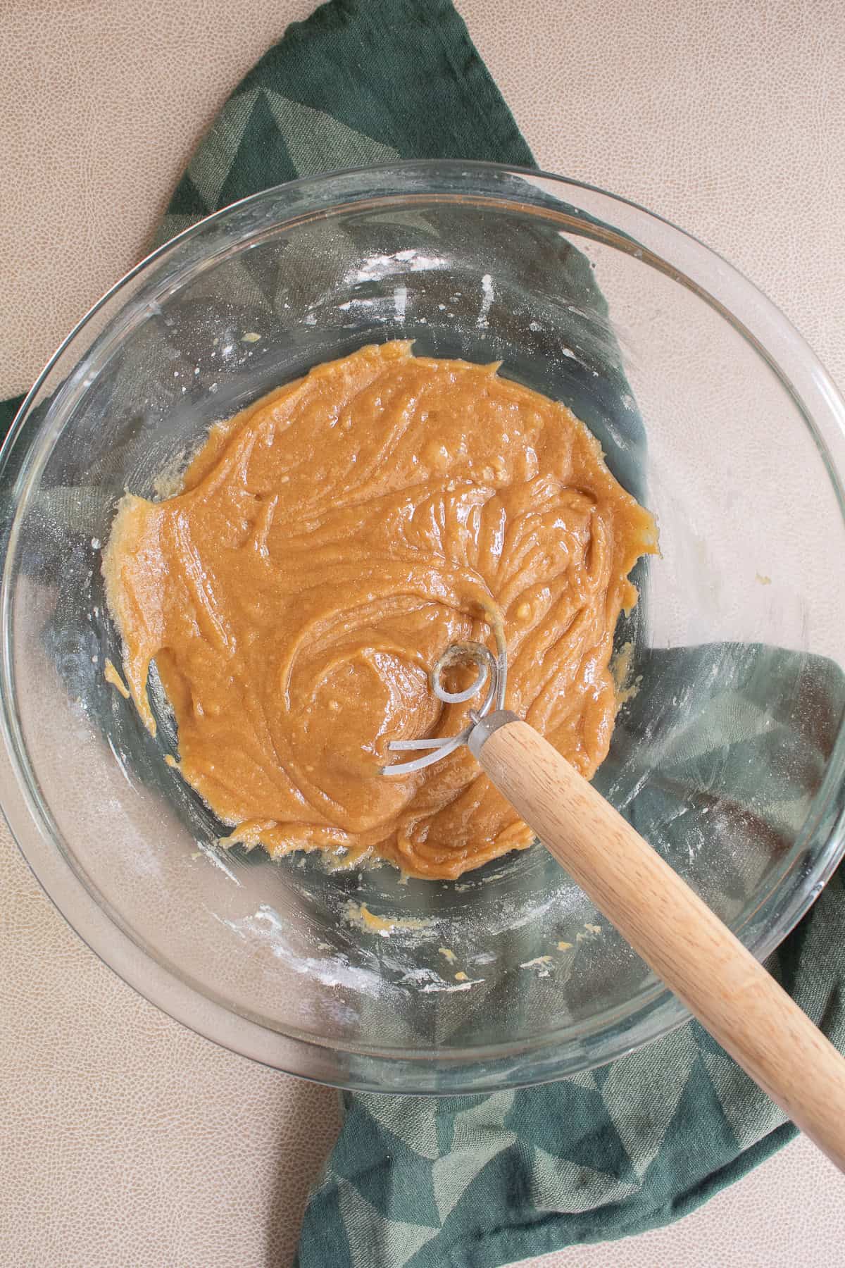 The mixed dough is glossy and thick.