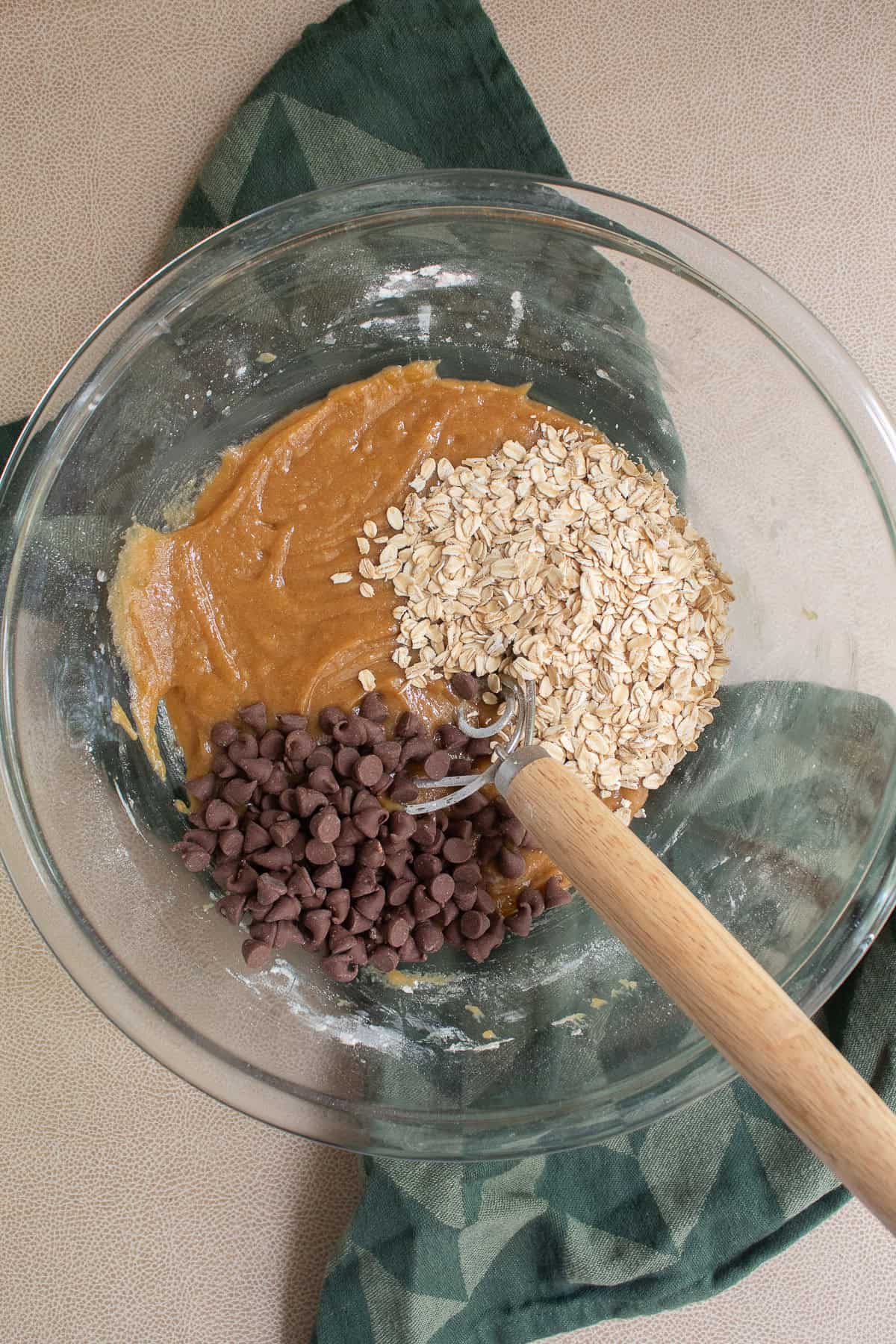 Rolled oats and chocolate chips are added to the cookie dough.