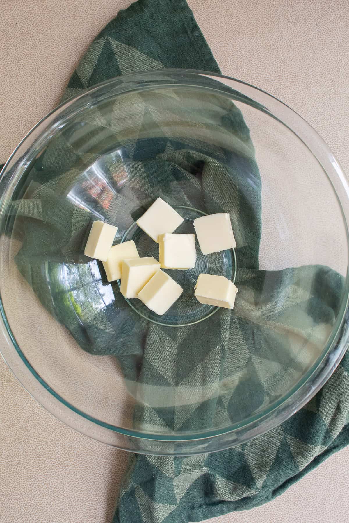 Butter is added to a large mixing bowl.