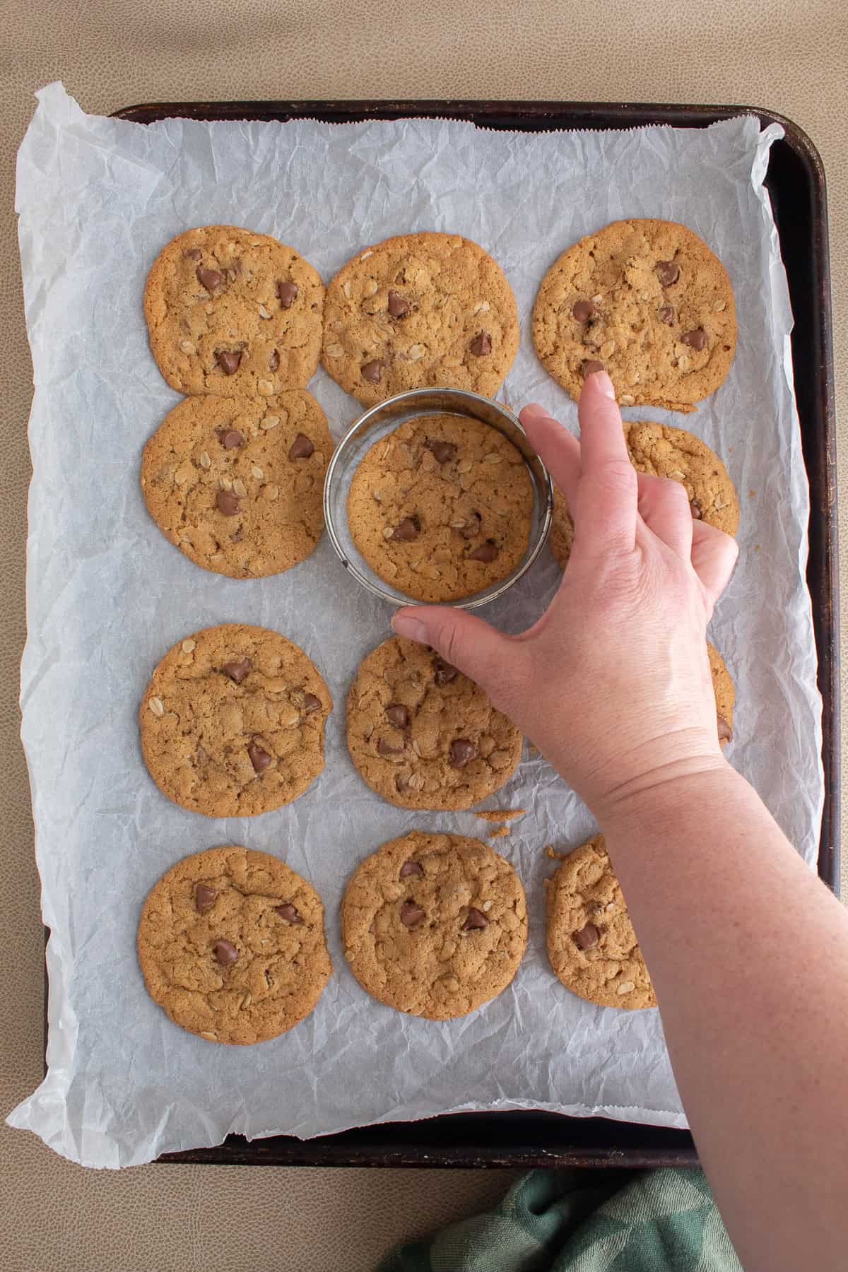 A ring cookie cutter is used to shape the cookies as they come out of the oven.