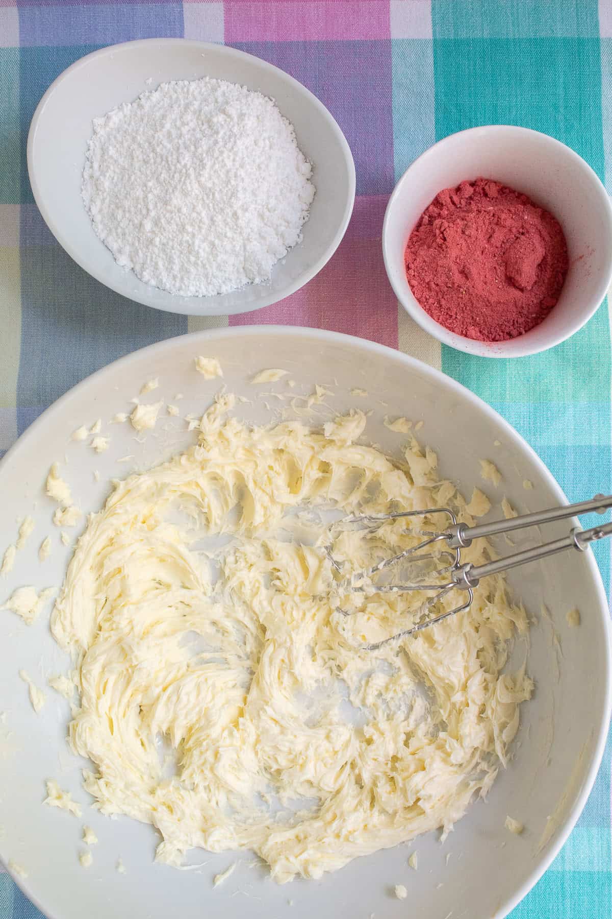 Softened butter is whipped until light in color and fluffy in texture.