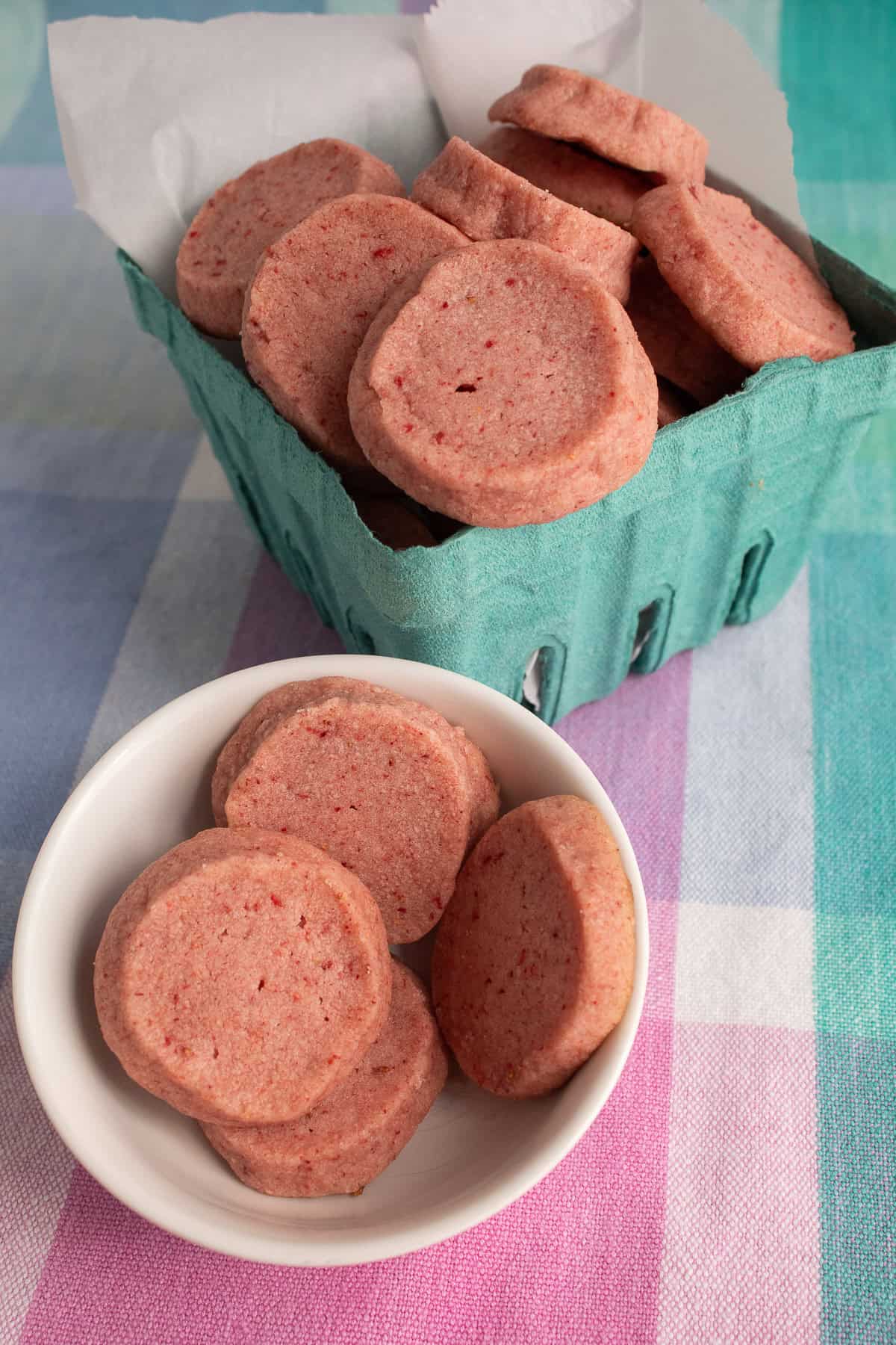 Plain strawberry shortbread cookies are a simple treat displayed in a berry box.