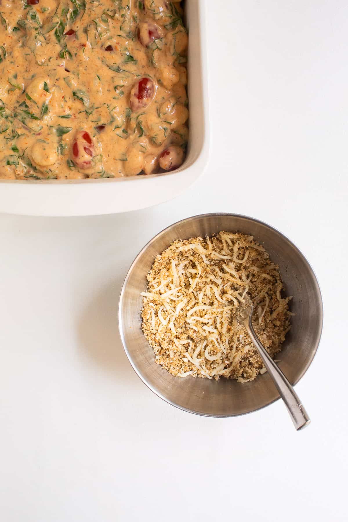 The breadcrumb mixture is a sandy texture in the medium bowl.