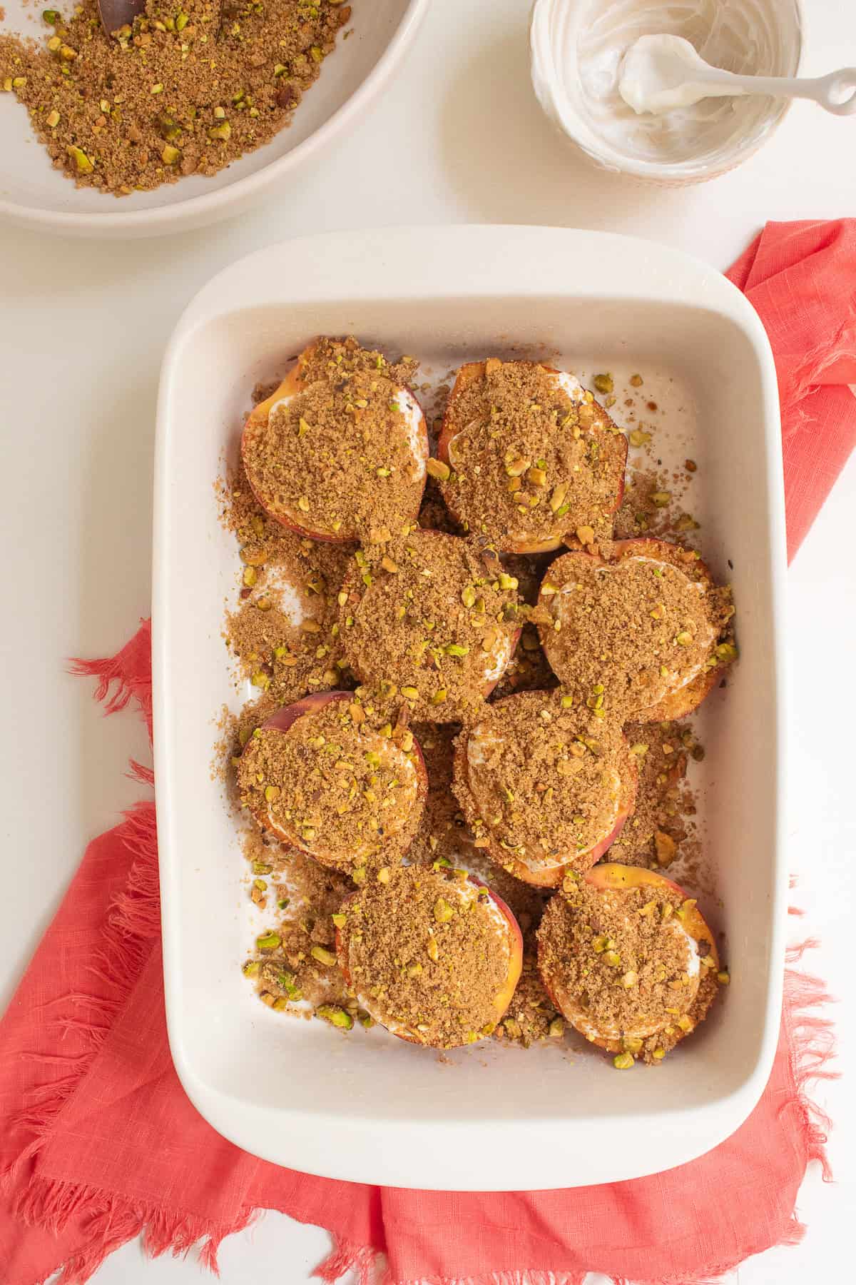 The sour cream is covered with a mixture of pistachios, cinnamon, and brown sugar.