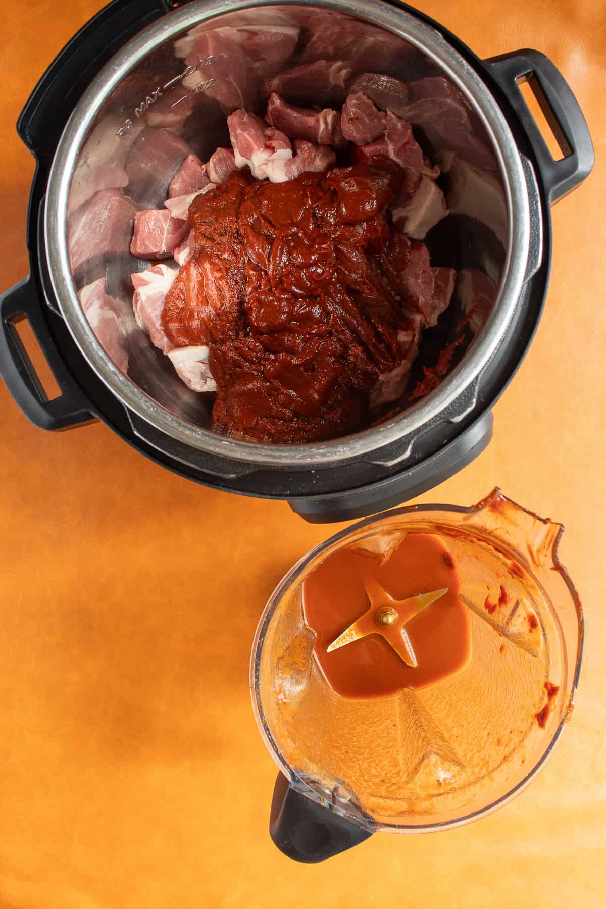 The sauce is transferred to the cooking pot and water is used to rinse out the blender pitcher.
