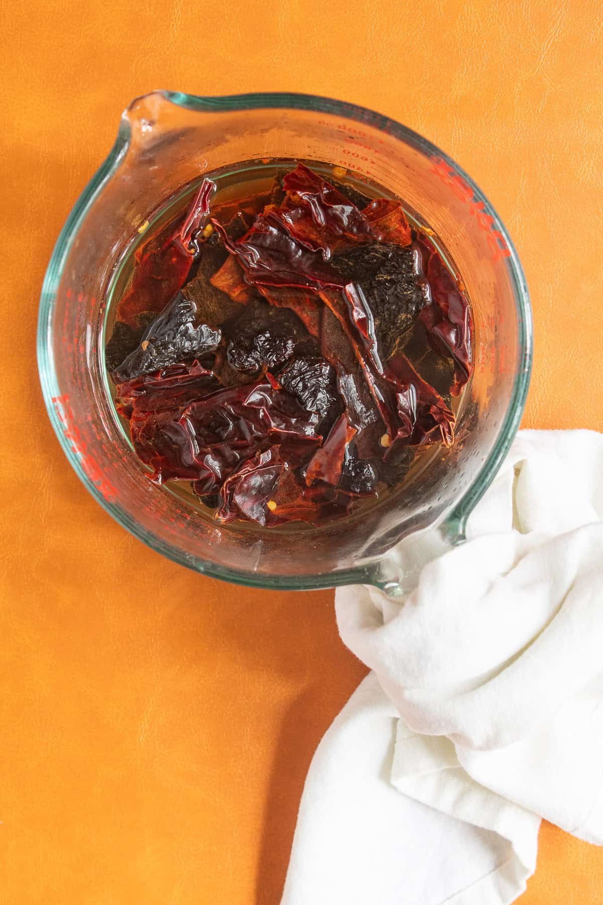 The toasted chiles soak in water to soften.