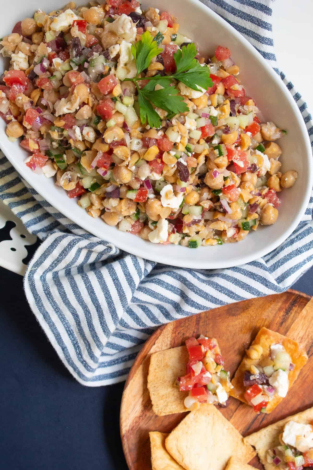 The dip is served in a white bowl and garnished with fresh parsley.
