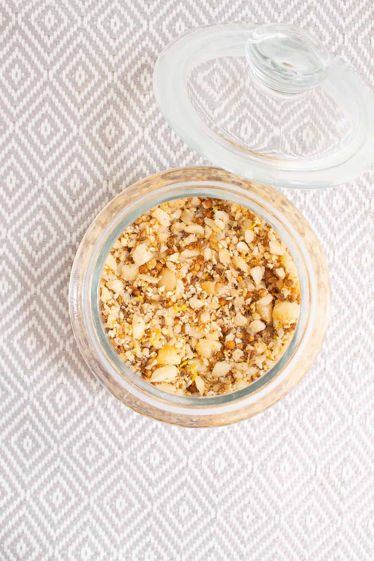 The dukkah is stored in an airtight jar.