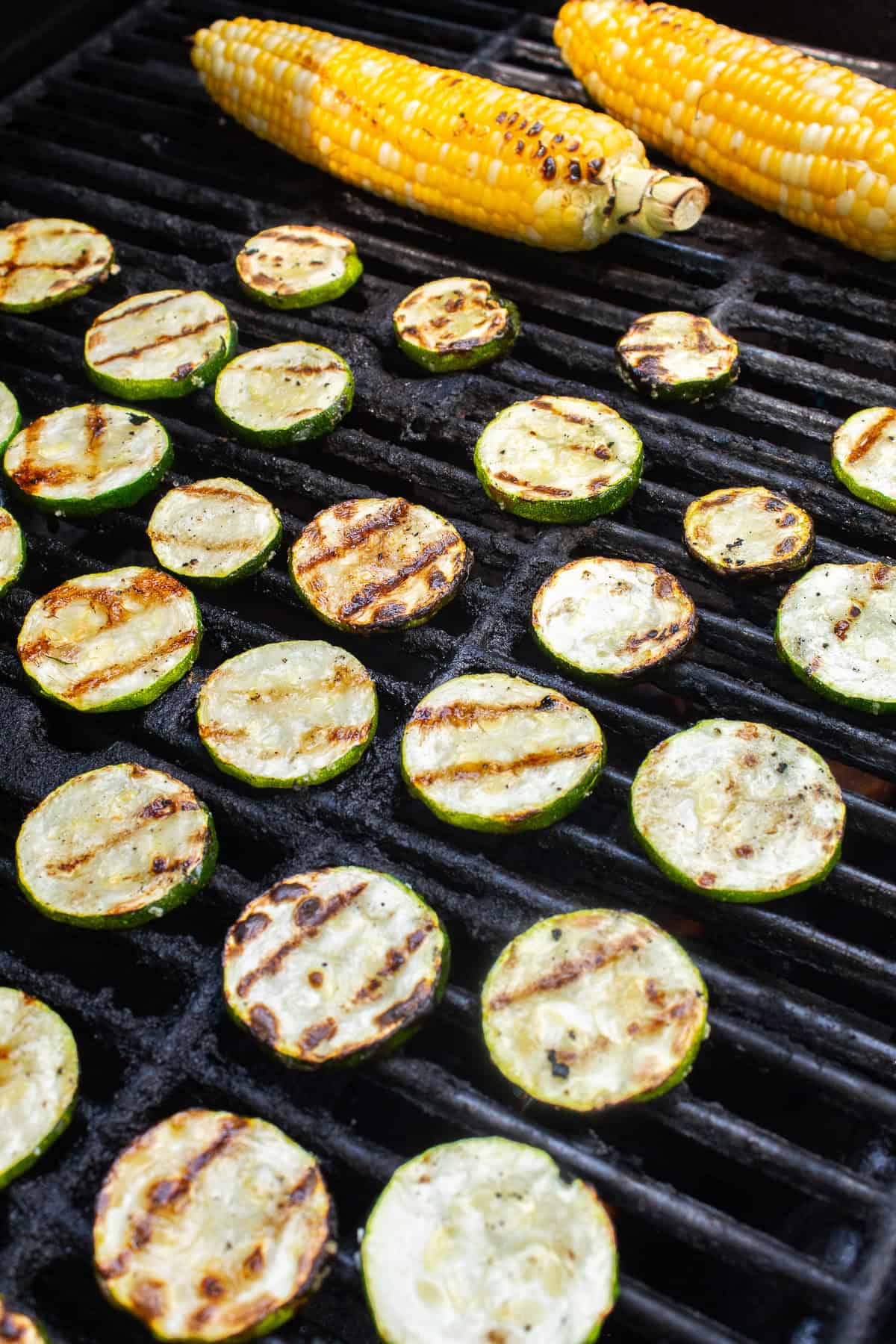 Zucchini slices and whole ears of corn are grilled until lightly charred.