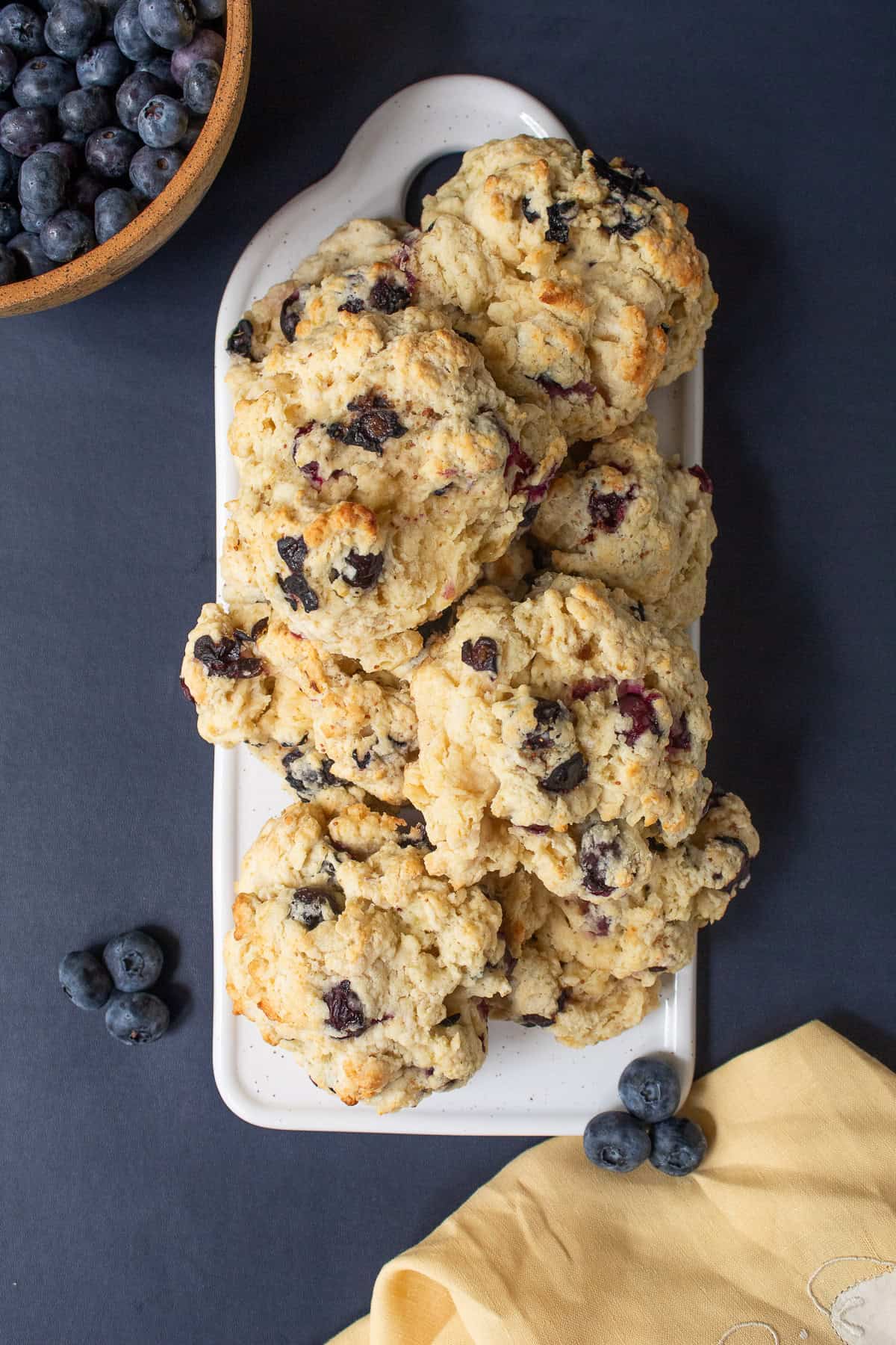 The baked biscuits are golden and studded with juicy blueberries.
