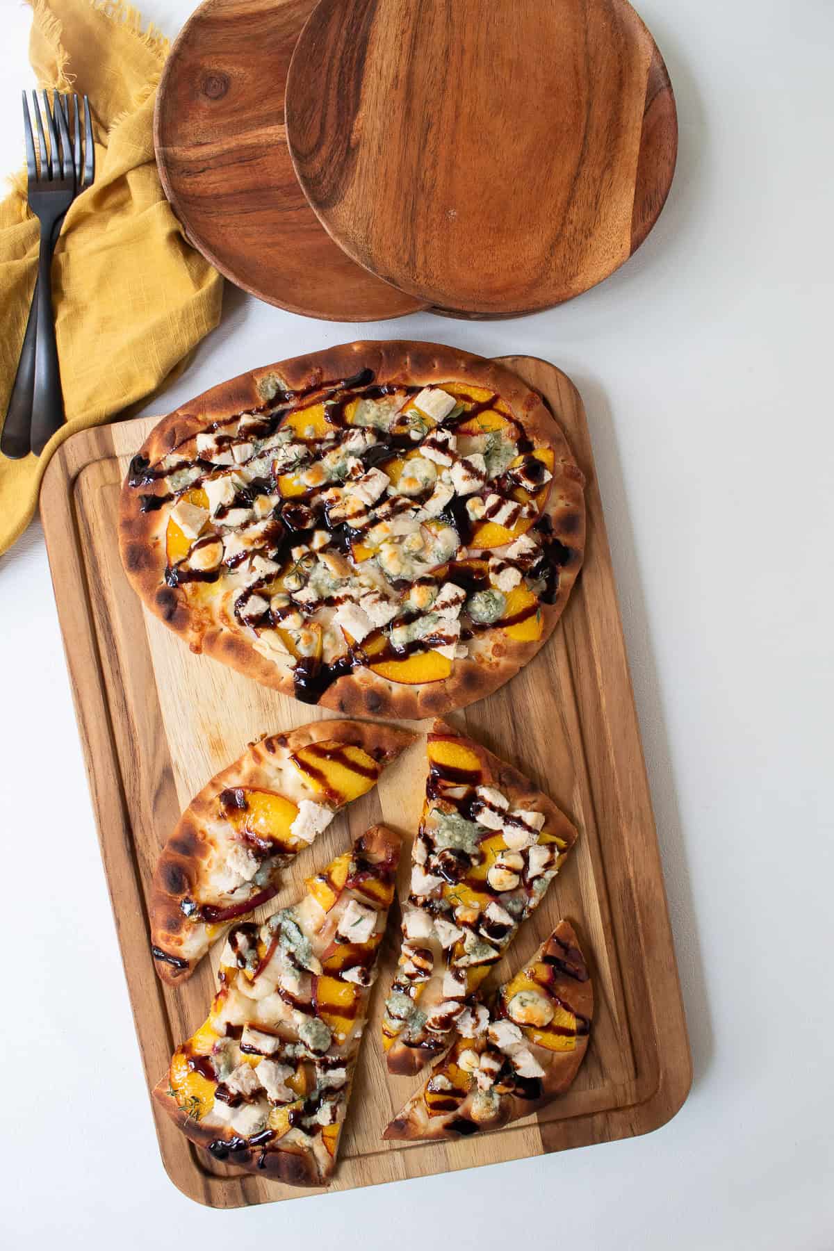 The pizza is sliced for serving.