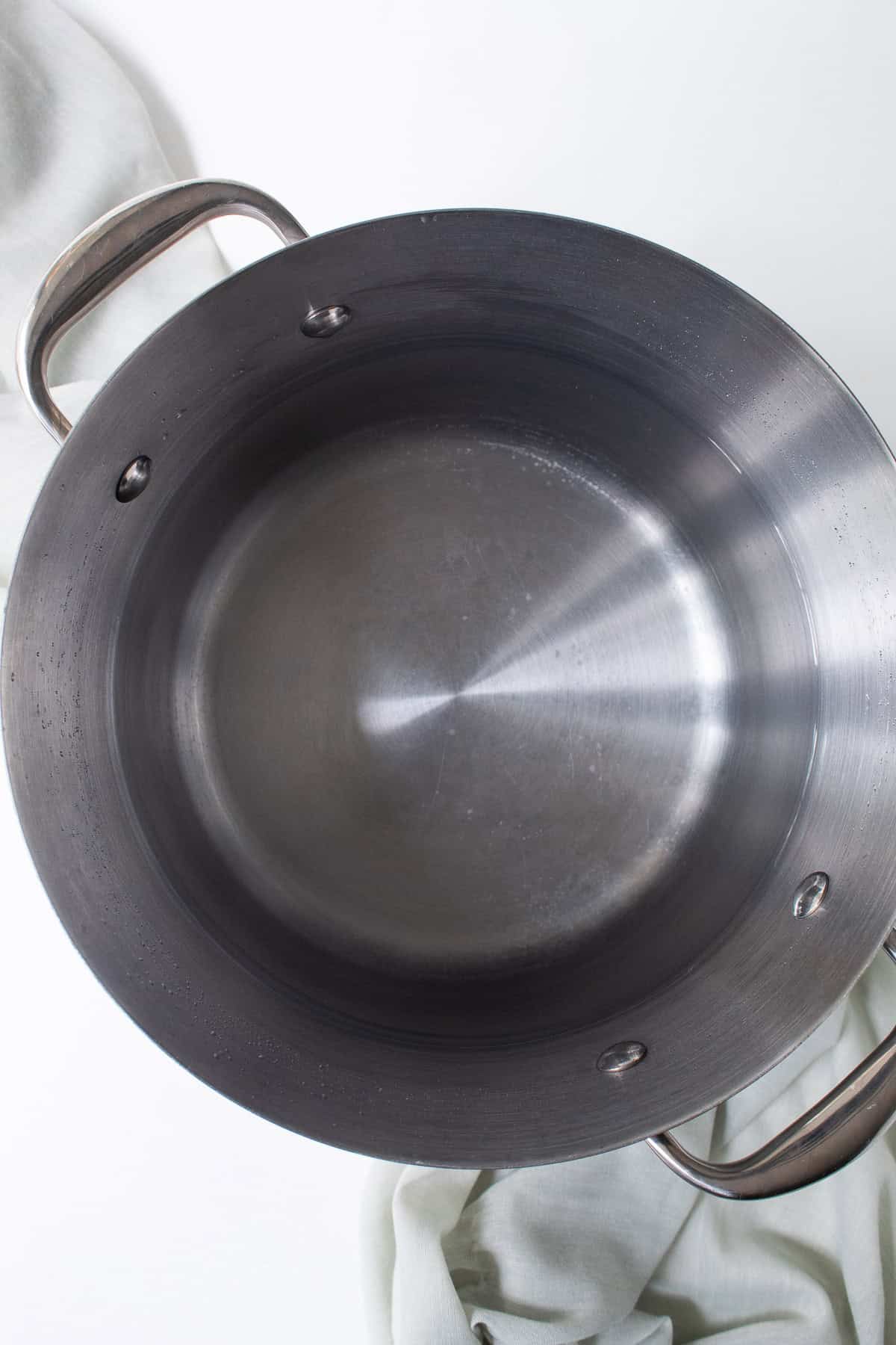 A large pot of water is ready to heat for cooking the pasta.