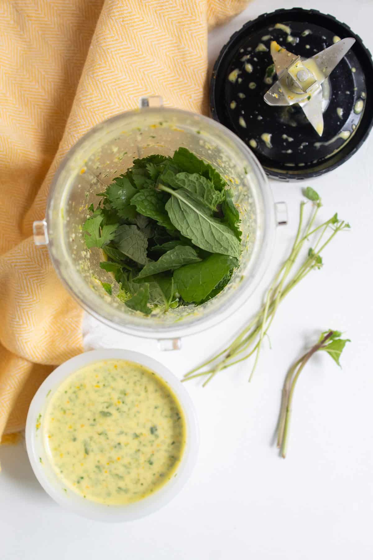 Mint, cilantro, and lime are added to the marinade to make the mojo sauce.