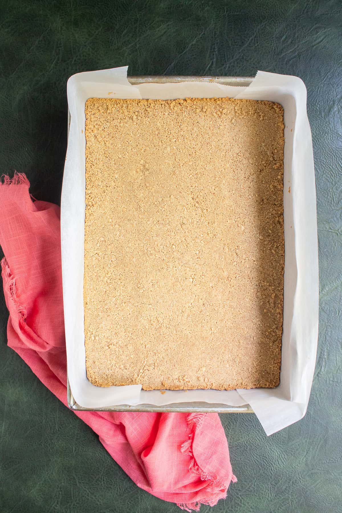 The baked graham cracker crust is lightly golden at the edges.
