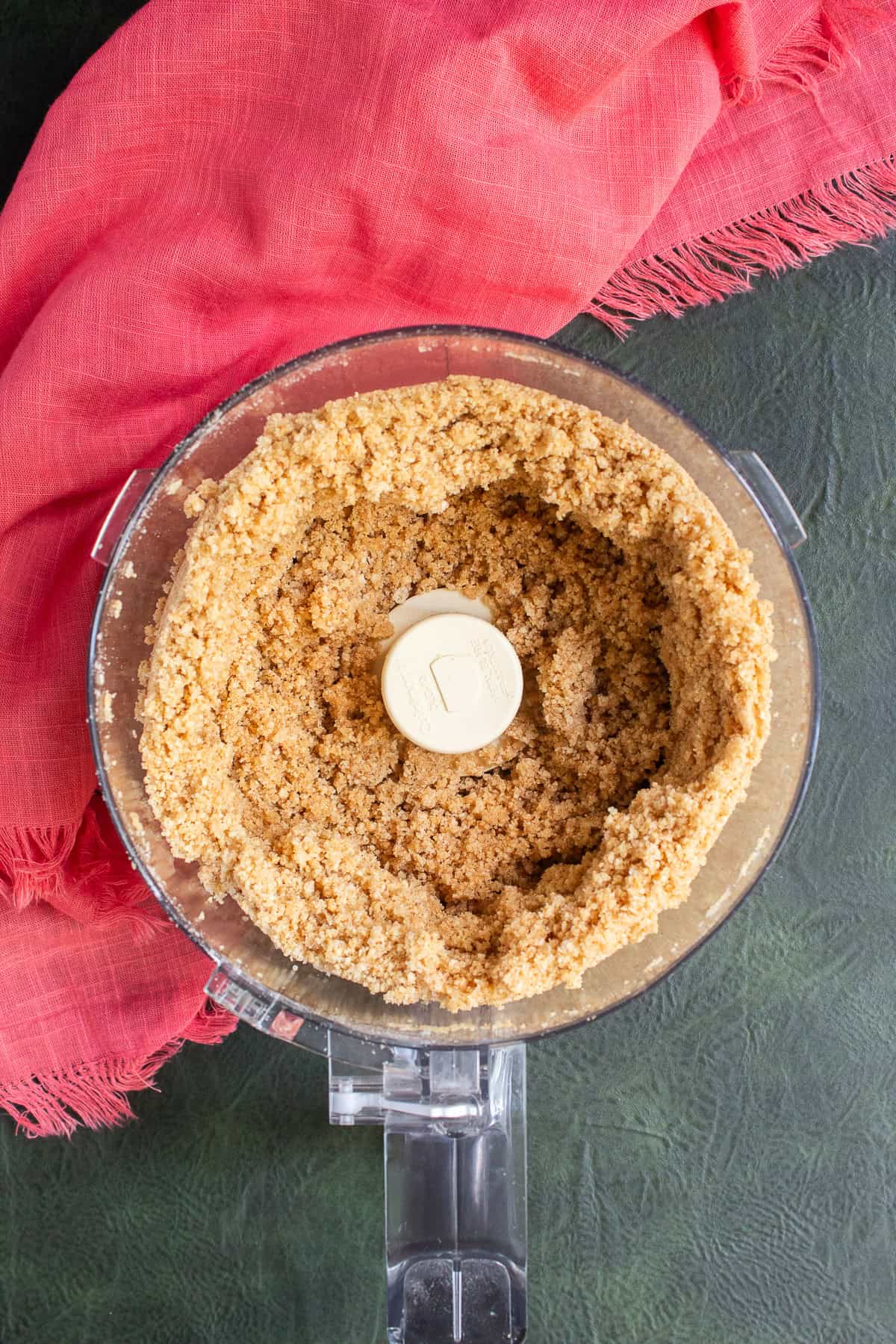 The processed graham crackers and butter make a sandy micture.