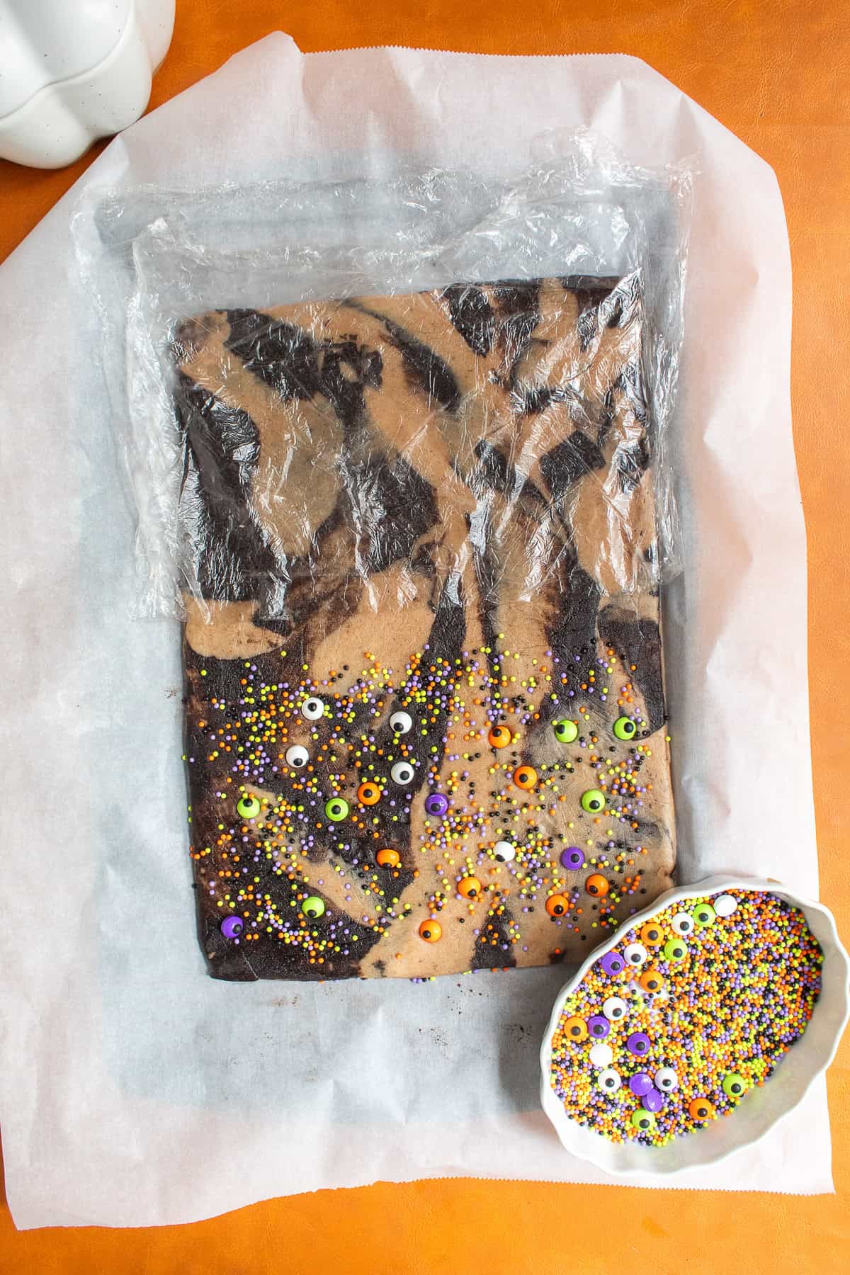 Sprinkles are pressed into half of the dough before chilling.