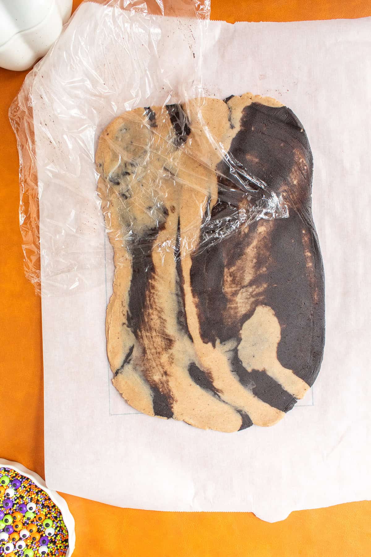 When the dough is rolled out, a marbled effect is created between the spice and chocolate pieces.