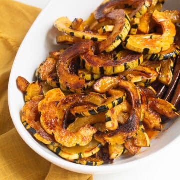 The deeply caramelized roasted delicata squash is glazed with the maple and ancho vinaigrette.