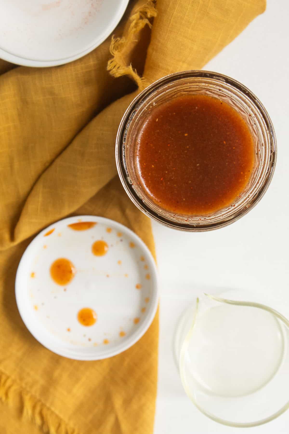 The maple and ancho vinaigrette is a deep orange-red color.