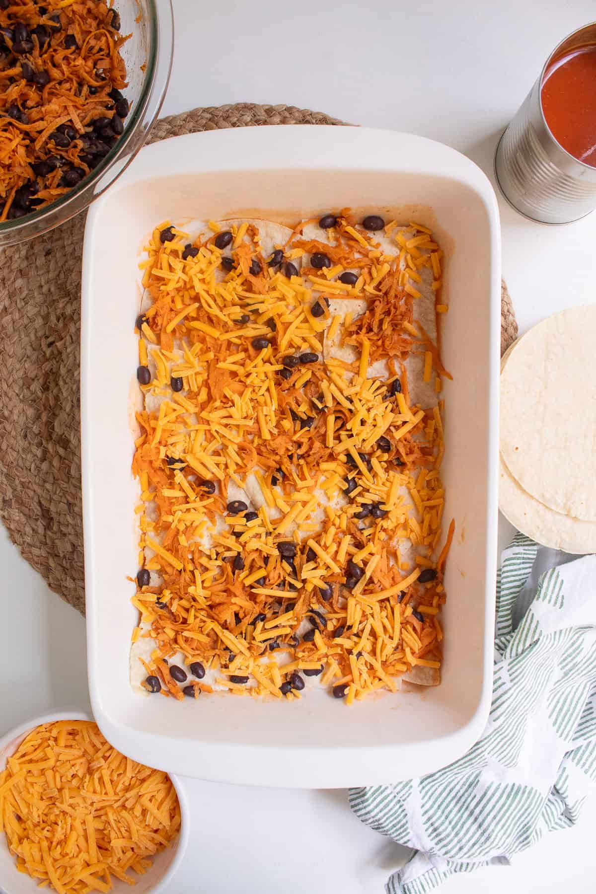 Sharp cheddar is layered over the bean and sweet potato filling.