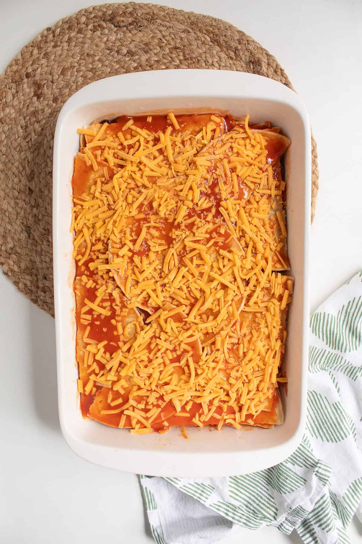 Shredded cheese is sprinkled over the entire casserole.