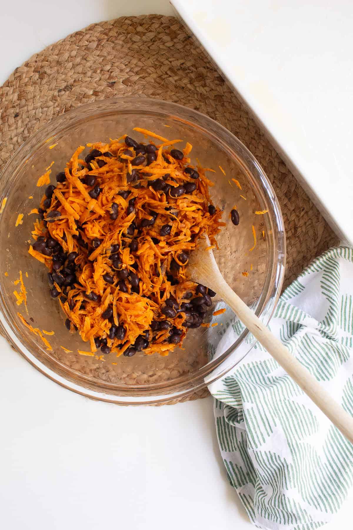 The steamed sweet potato shreds are mixed with the spices and black beans.
