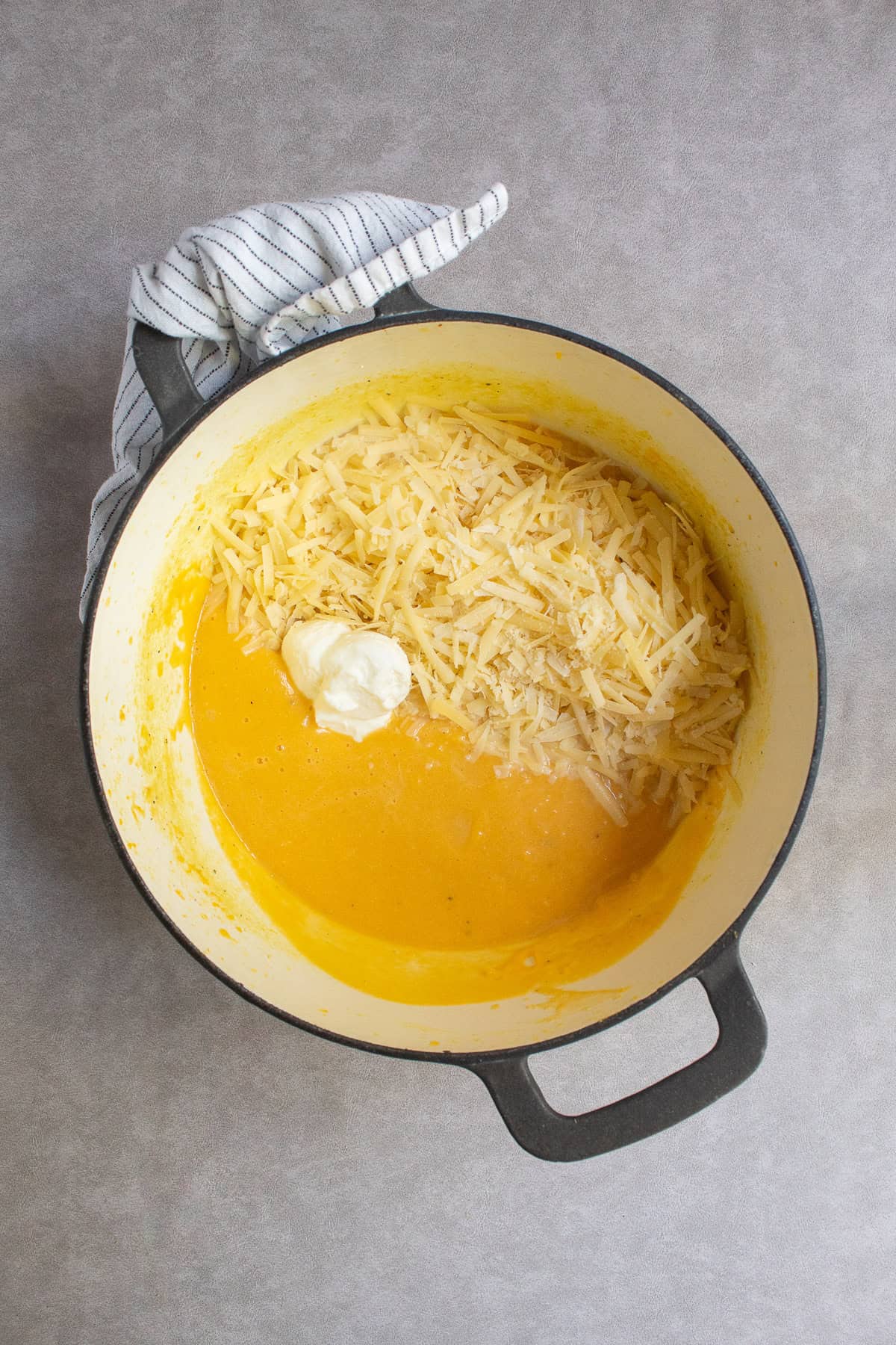 Greek yogurt and the shredded Gruyère and Parmesan cheeses are added to the blended squash sauce.