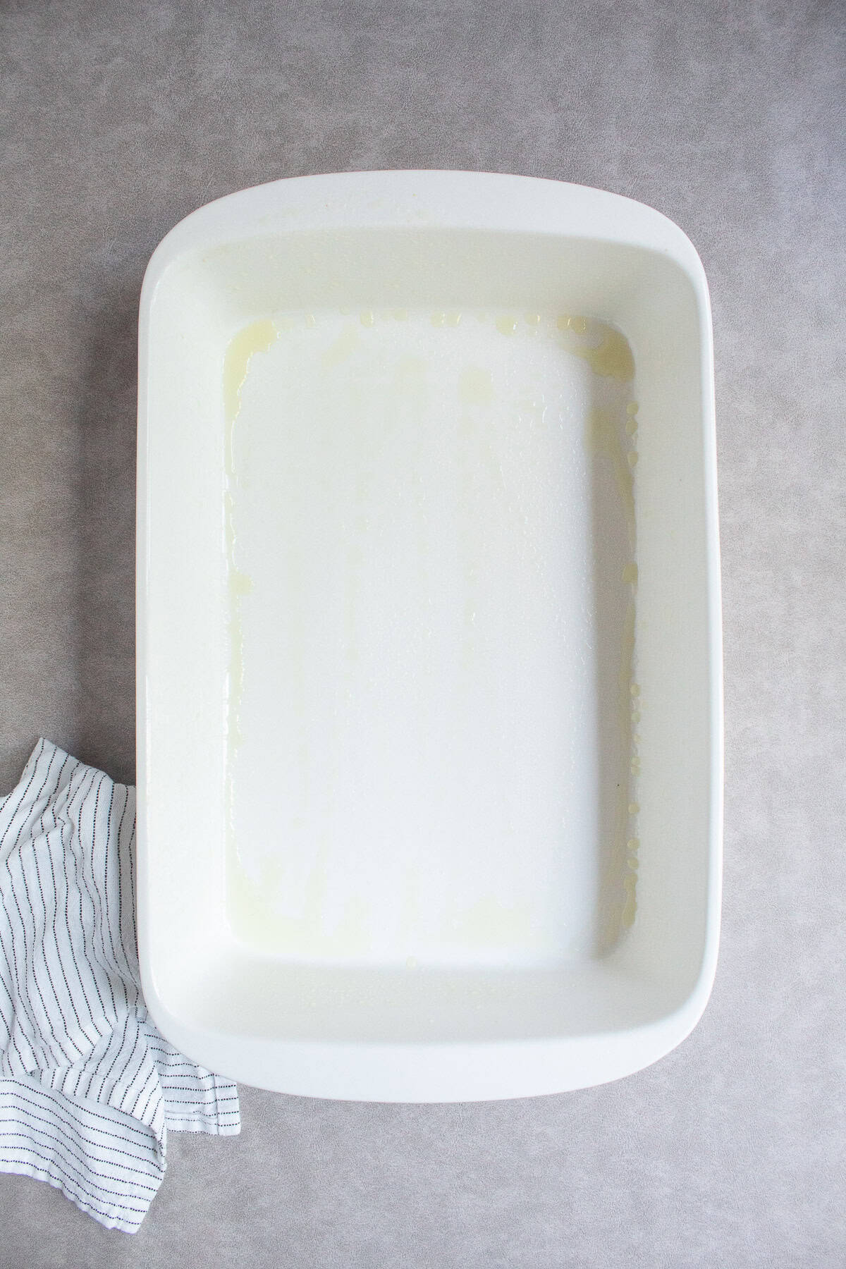 A large baking dish is sprayed with cooking spray.
